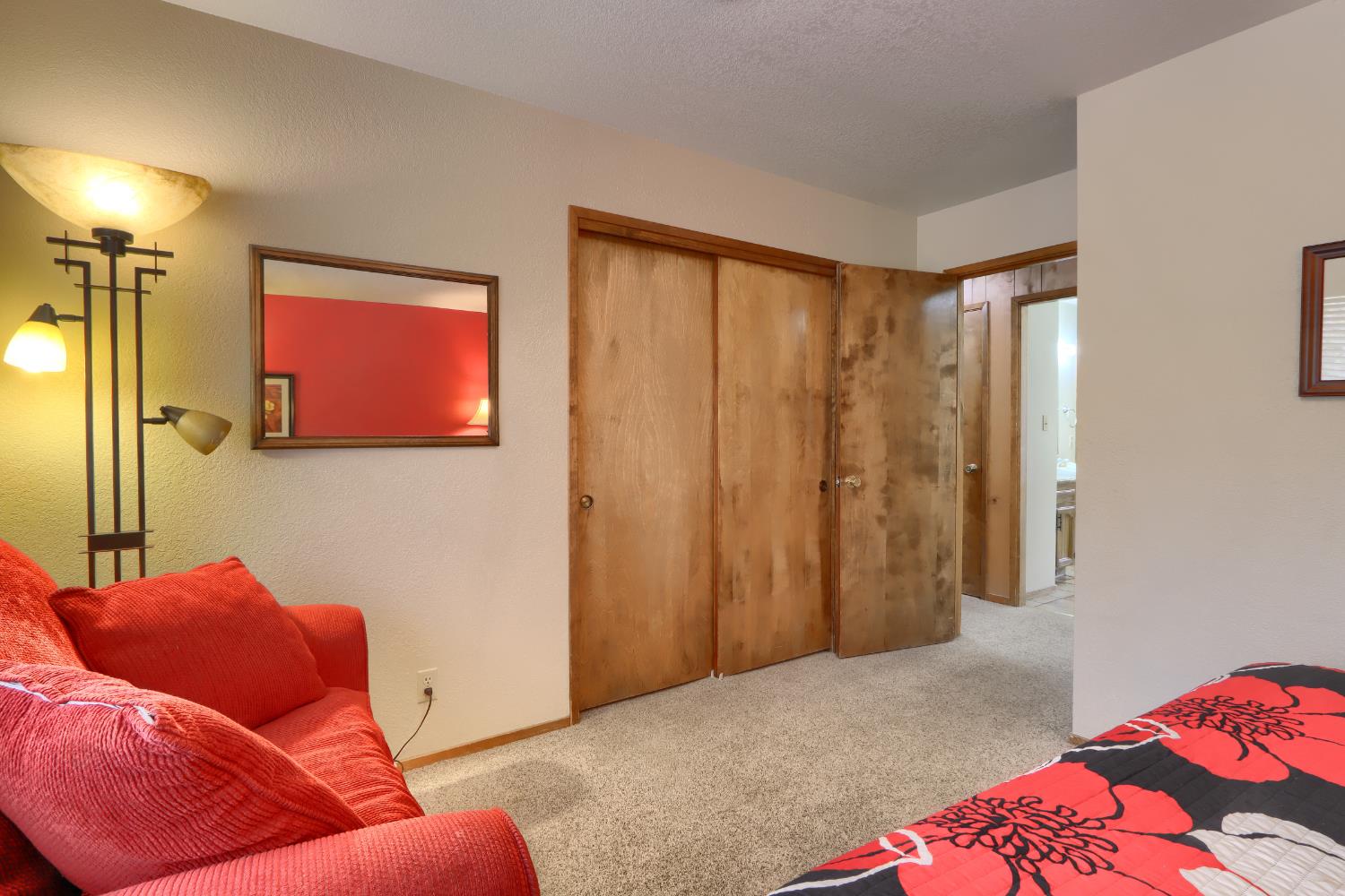 8041 Chilnualna Falls Road Wawona, CA 95389 - Photo 14 of 46 a bedroom with a bed and a couch