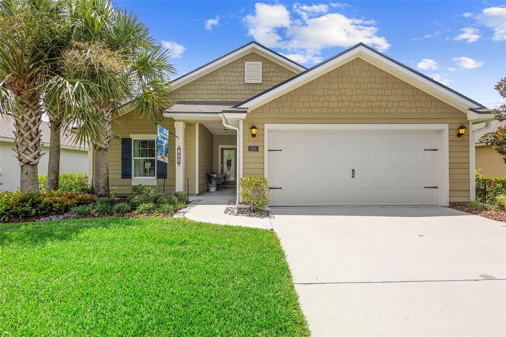 195 Palace Drive St. Augustine, FL 32084 - Photo 1 of 1 a front view of a house with a yard and garage