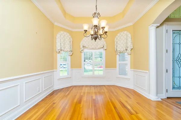 a kitchen with stainless steel appliances granite countertop a refrigerator a stove and a sink