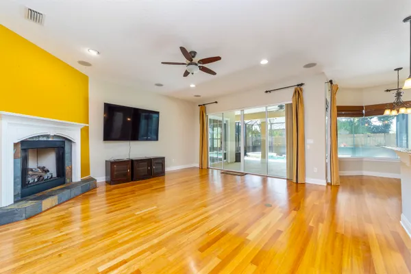 a large kitchen with stainless steel appliances and large counter top