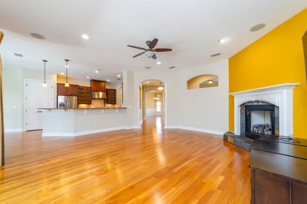 a view of wooden floor and windows in a room