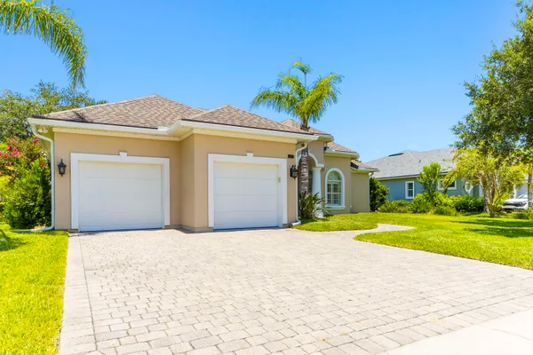a view of a room with wooden floor and windows