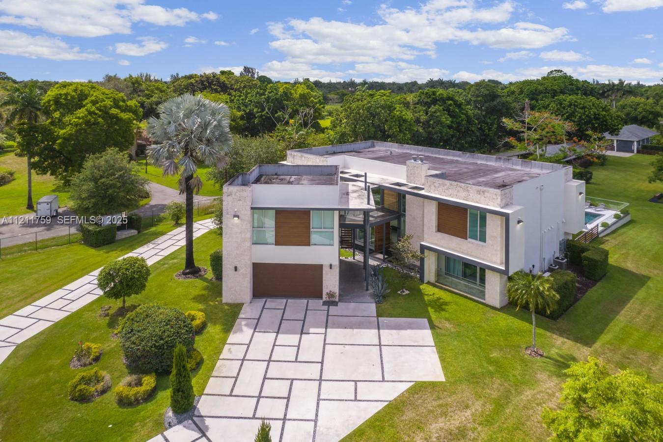 14305 Stirling Road Southwest Ranches, FL 33330 - Photo 57 of 66 a aerial view of a house with a yard