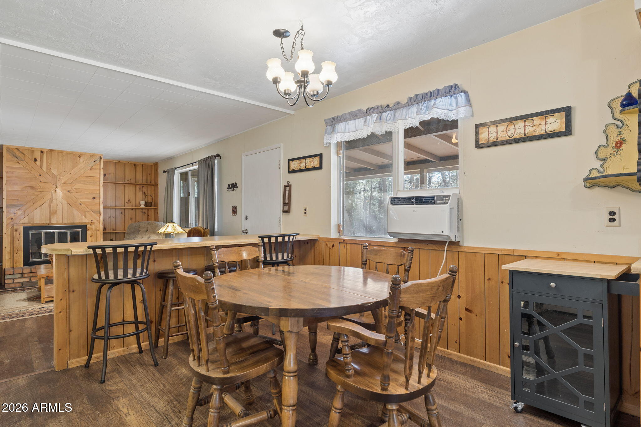 8726 Emmas View Pine, AZ 85544 - Photo 12 of 29 a view of a dining room with furniture and chandelier