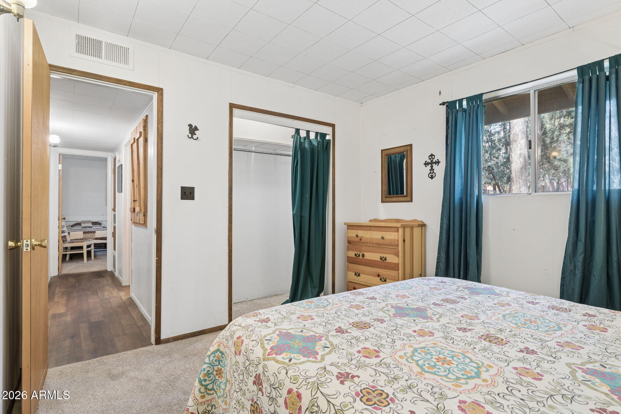 8726 Emmas View Pine, AZ 85544 - Photo 15 of 29 a bedroom with a bed and a dresser