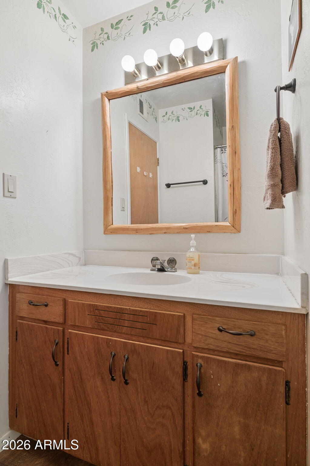 8726 Emmas View Pine, AZ 85544 - Photo 16 of 29 a bathroom with a sink vanity and mirror