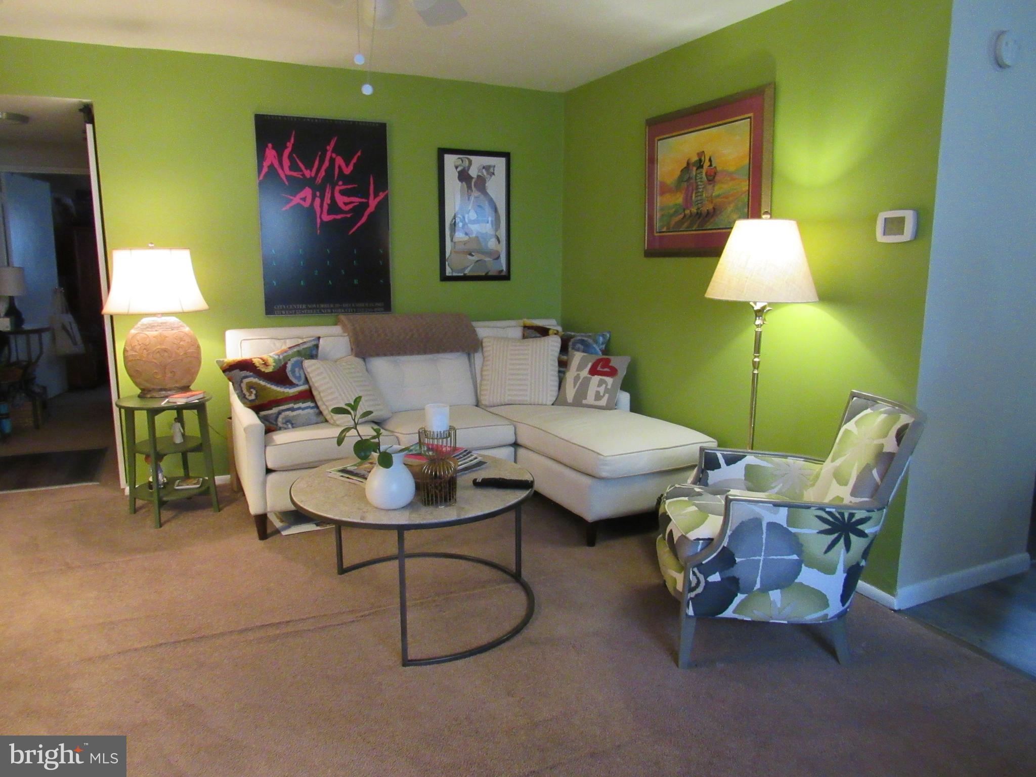 4000 Gypsy Lane, Unit 622F1 Philadelphia, PA 19129 - Photo 12 of 45 a living room with furniture and a lamp