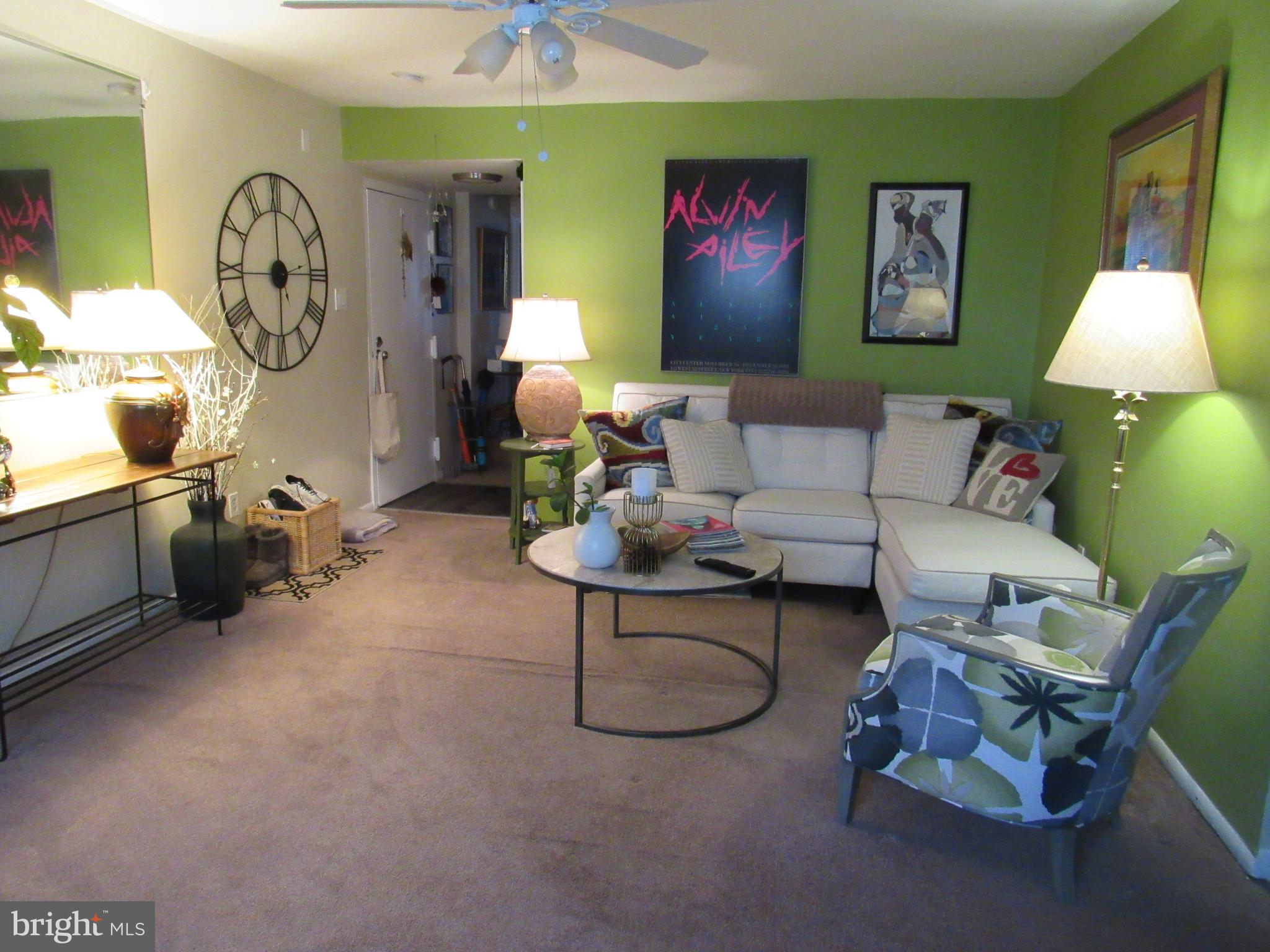 4000 Gypsy Lane, Unit 622F1 Philadelphia, PA 19129 - Photo 13 of 45 a living room with furniture a window and a table