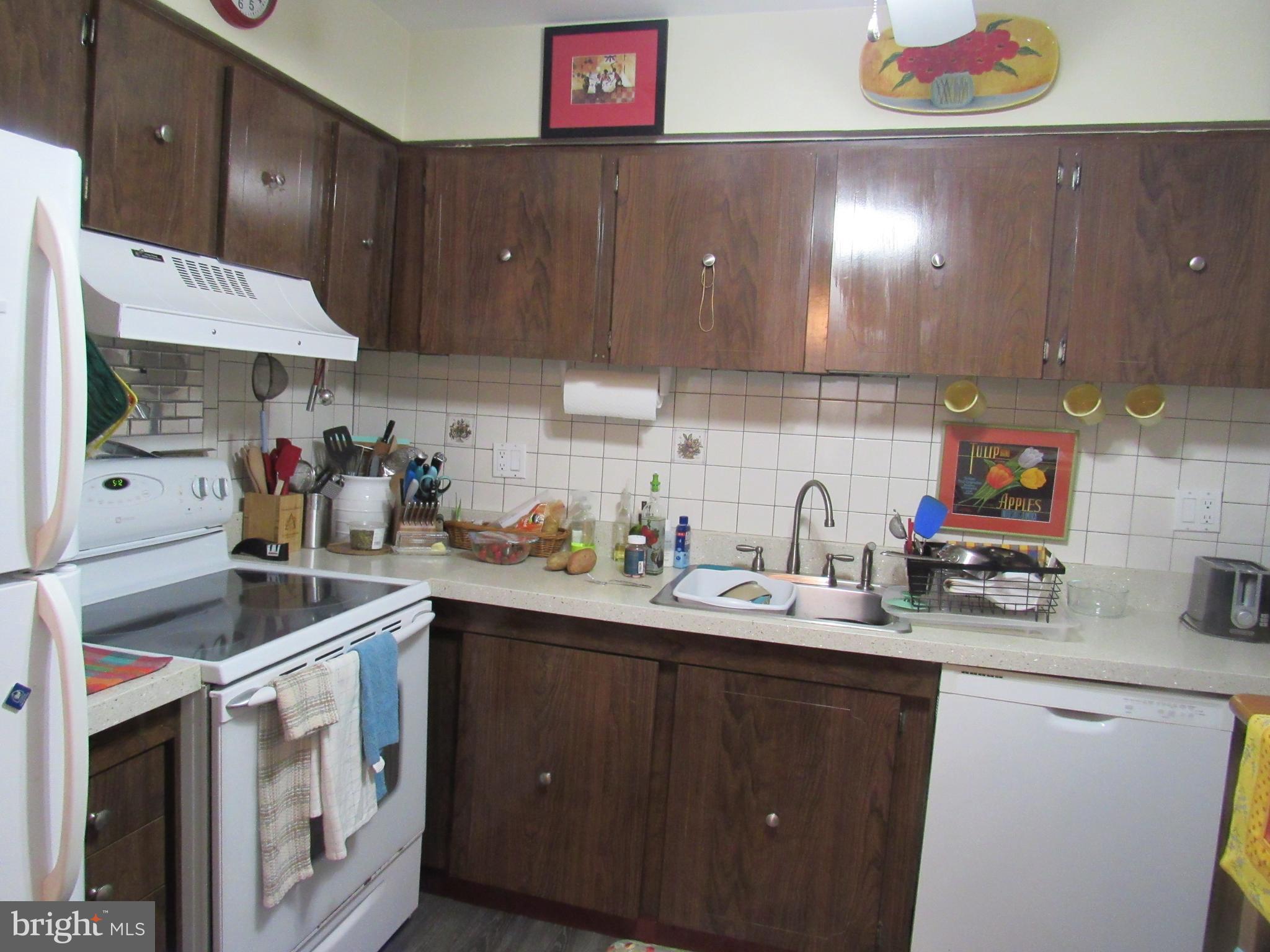 4000 Gypsy Lane, Unit 622F1 Philadelphia, PA 19129 - Photo 17 of 45 a kitchen with a sink cabinets and window