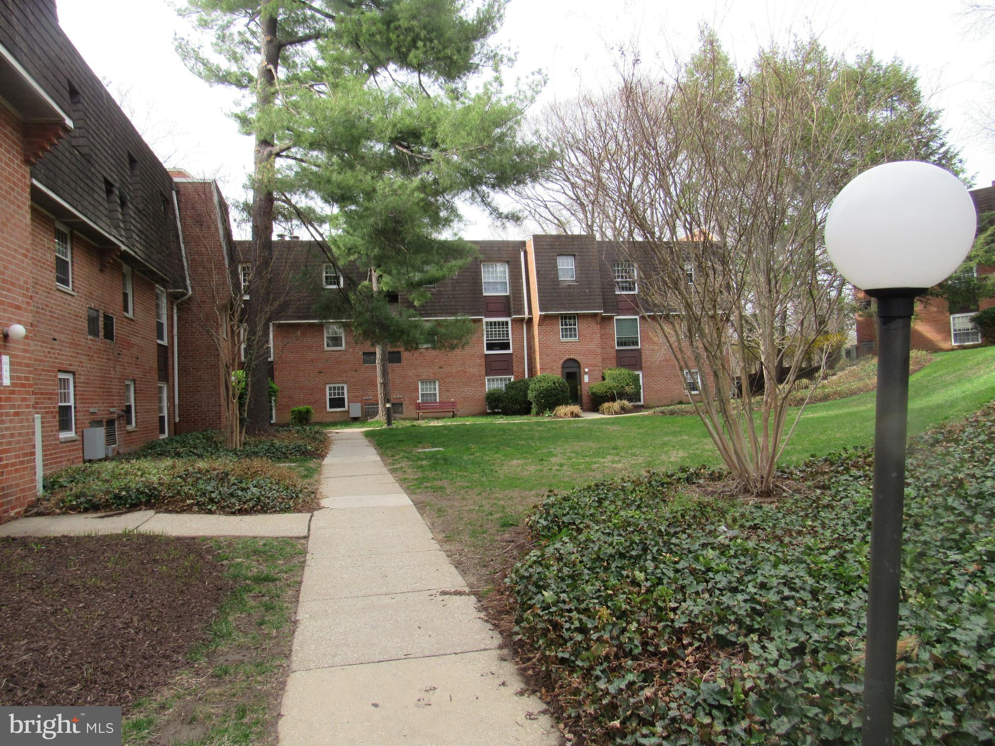 4000 Gypsy Lane, Unit 622F1 Philadelphia, PA 19129 - Photo 6 of 45 a front view of a house with garden