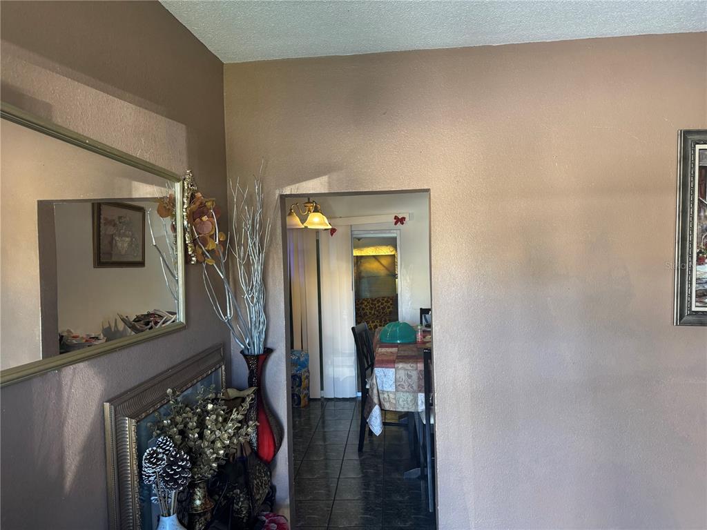 1620 36th Street Orlando, FL 32839 - Photo 2 of 7 a living room with furniture and a flat screen tv
