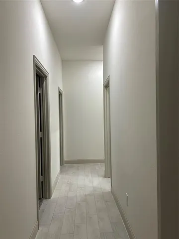 a view of hallway with mirror