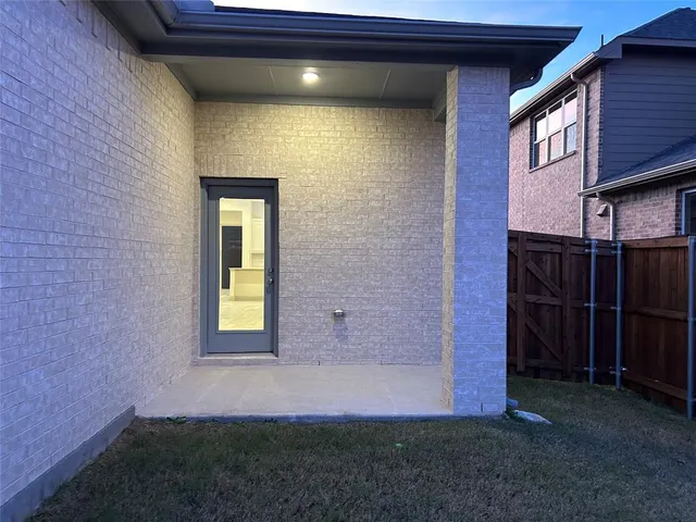 a view of a backyard with a tree