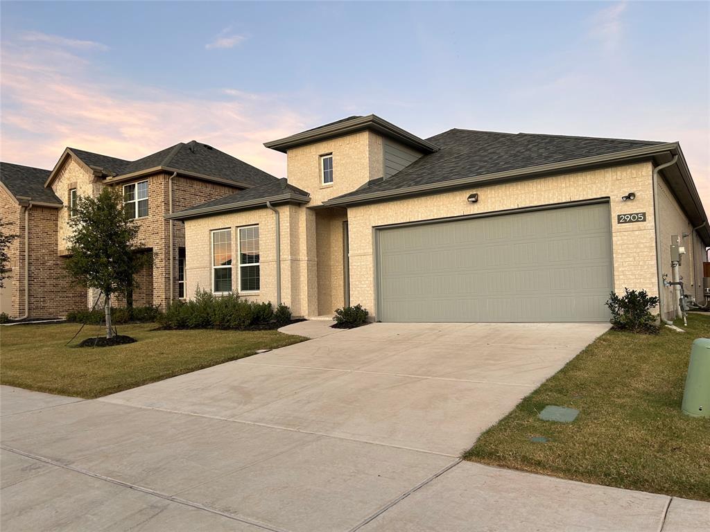 2905 Italia Terrace Princeton, TX 75407 - Photo 2 of 22 a front view of a house with a yard and garage