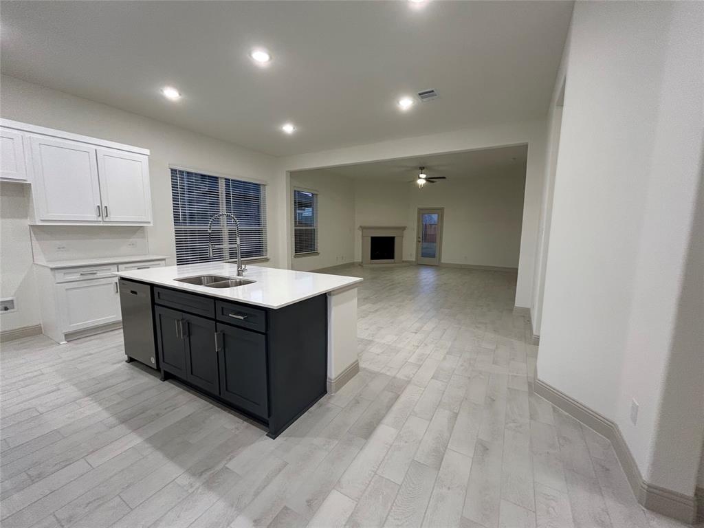 2905 Italia Terrace Princeton, TX 75407 - Photo 3 of 22 a kitchen with a sink and a stove top oven
