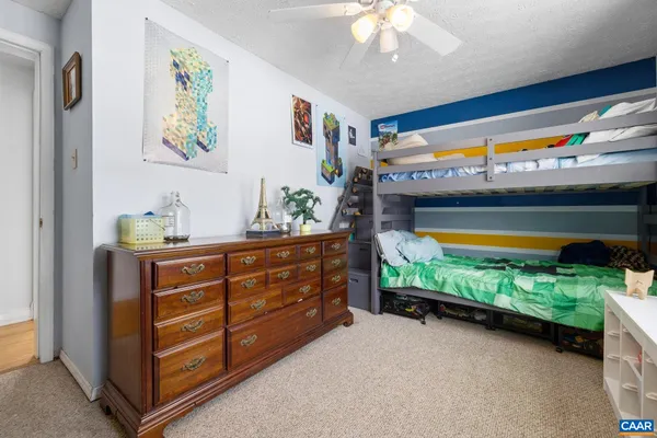 a room with furniture and a floor to ceiling window