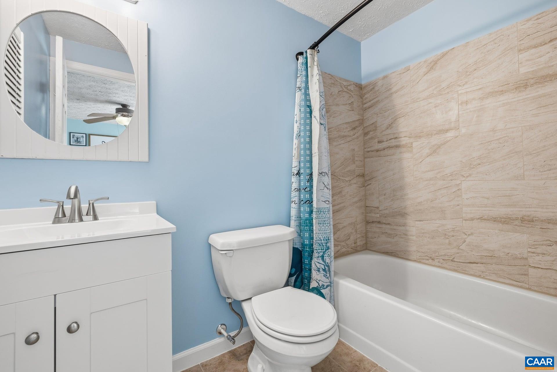 979 Cedar Grove Road Ruckersville, VA 22968 - Photo 26 of 33 a white toilet sitting next to a bath tub