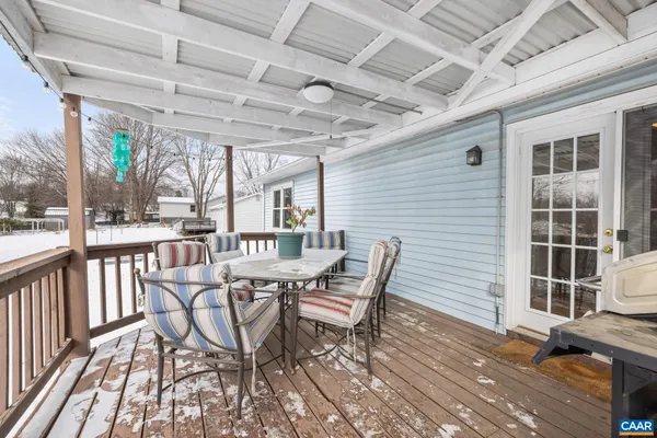 a view of a patio with a table and chairs