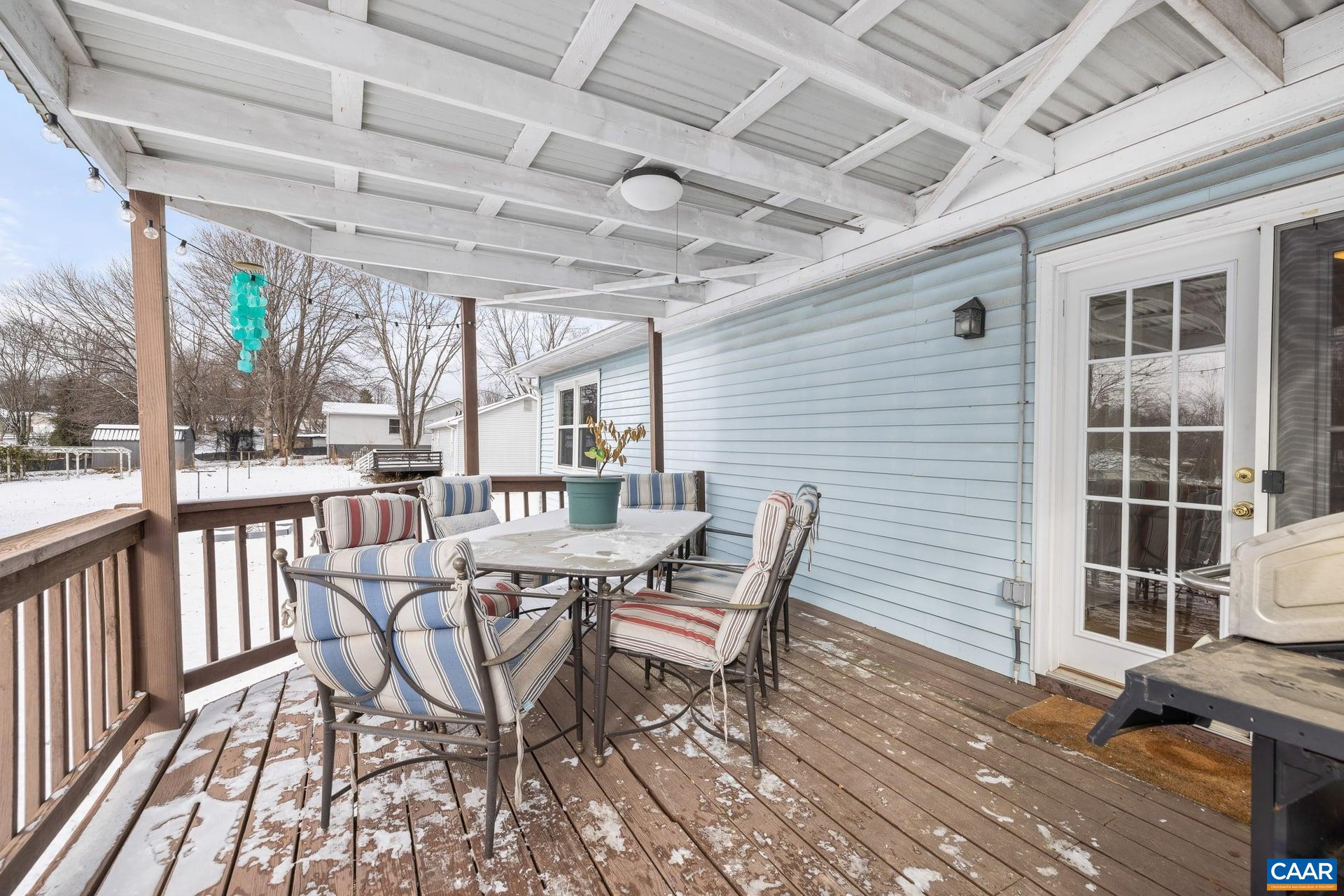 979 Cedar Grove Road Ruckersville, VA 22968 - Photo 28 of 33 a view of a patio with a table and chairs