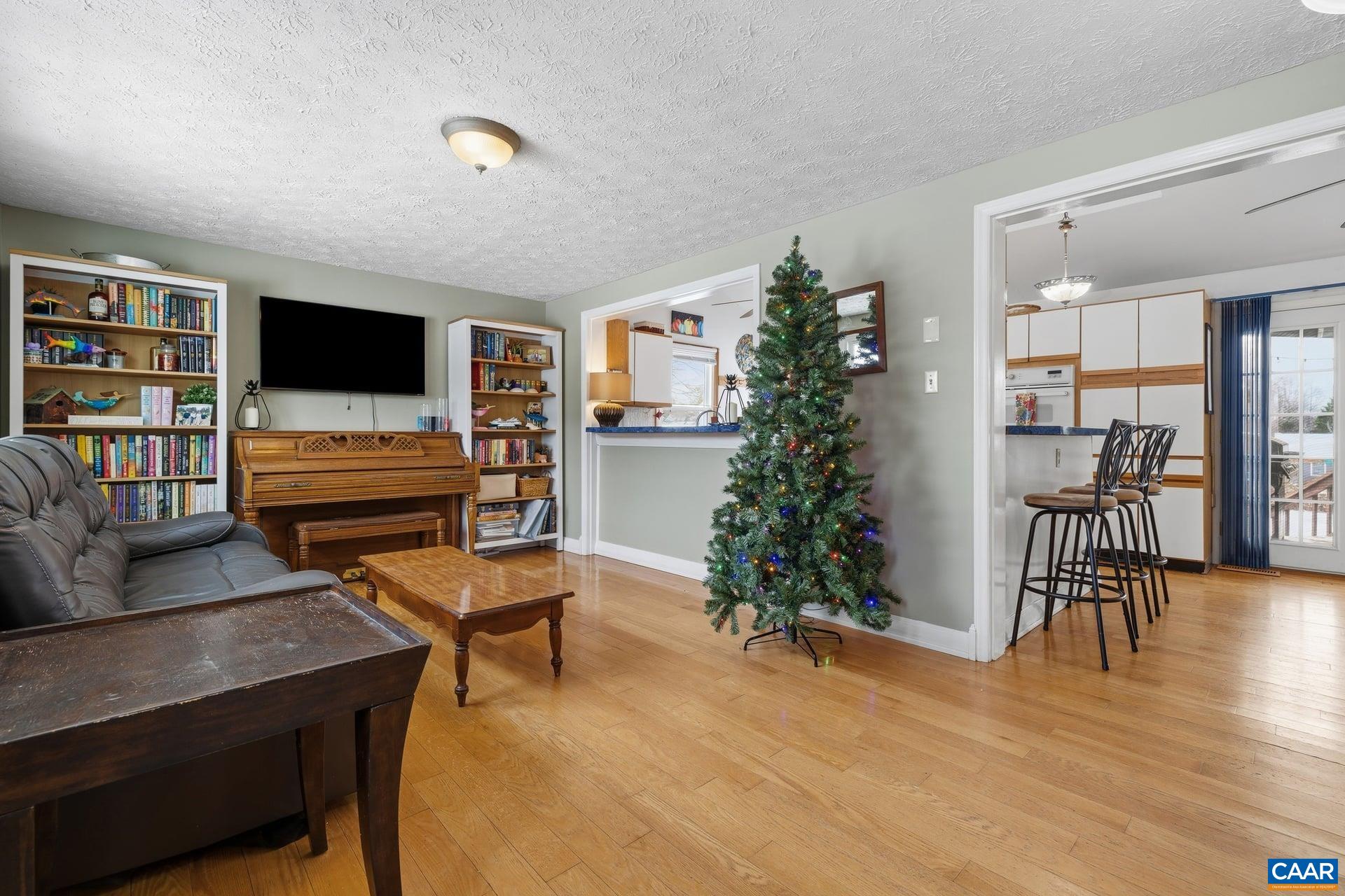 979 Cedar Grove Road Ruckersville, VA 22968 - Photo 5 of 33 a living room with furniture and a flat screen tv