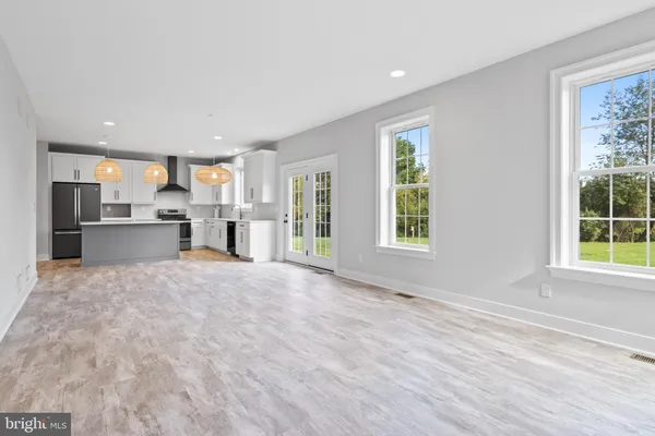 a kitchen with cabinets and window