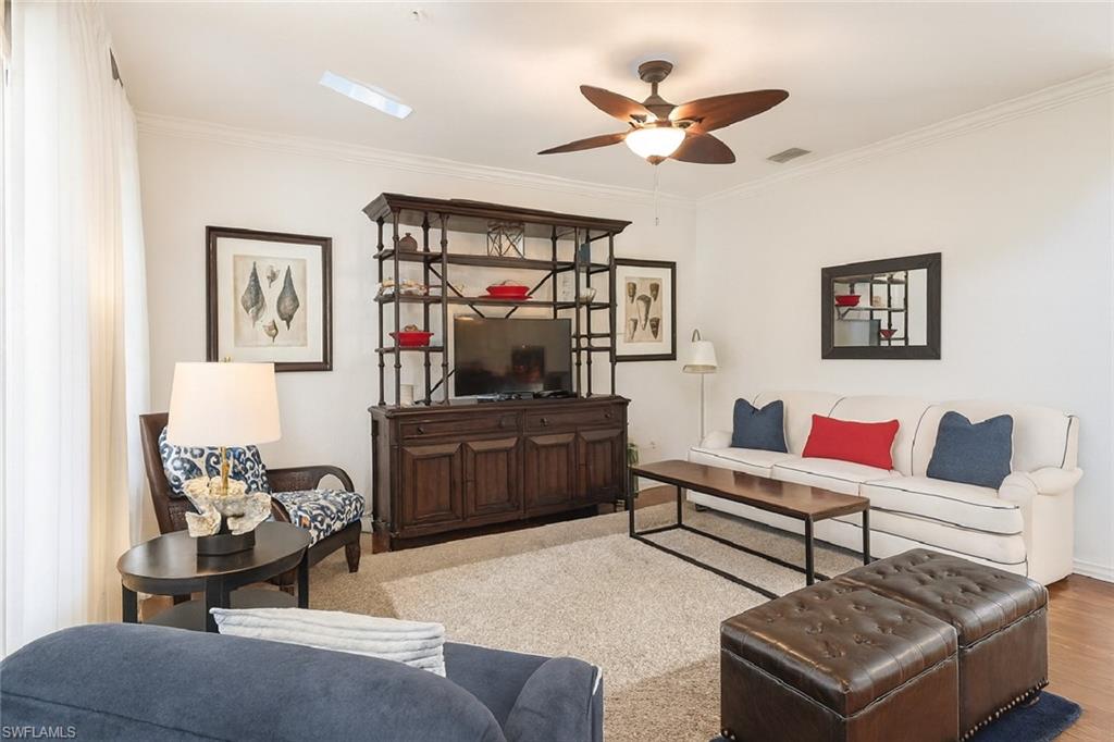 9055 Capistrano Street North, Unit 4206 Naples, FL 34113 - Photo 11 of 45 a living room with furniture