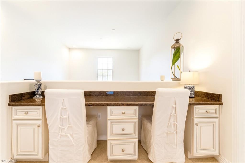 9055 Capistrano Street North, Unit 4206 Naples, FL 34113 - Photo 15 of 45 a kitchen with a stove a sink and a window