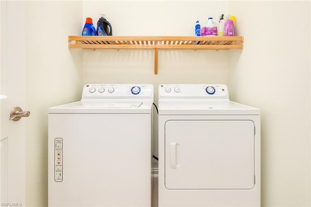 9055 Capistrano Street North, Unit 4206 Naples, FL 34113 - Photo 24 of 45 a utility room with dryer and washer