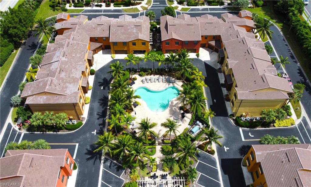 9055 Capistrano Street North, Unit 4206 Naples, FL 34113 - Photo 3 of 45 an aerial view of residential houses with outdoor space