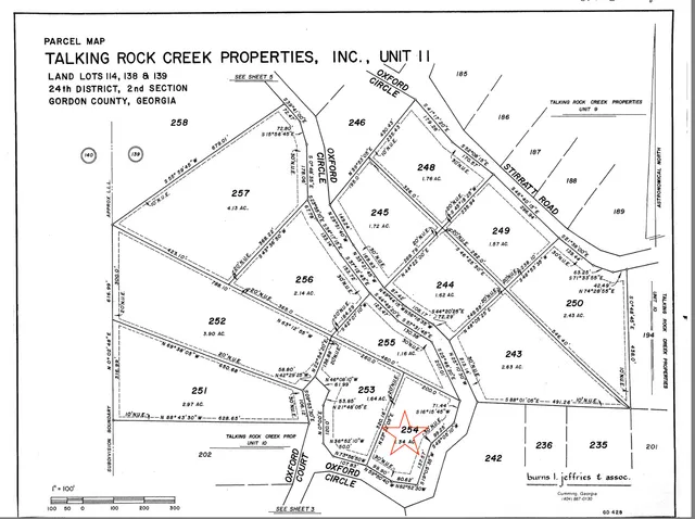a black and white photo of a green field