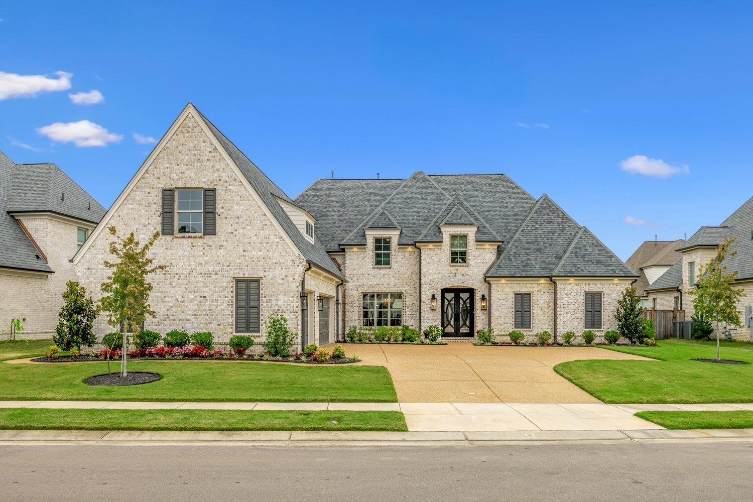 a front view of a house with a yard