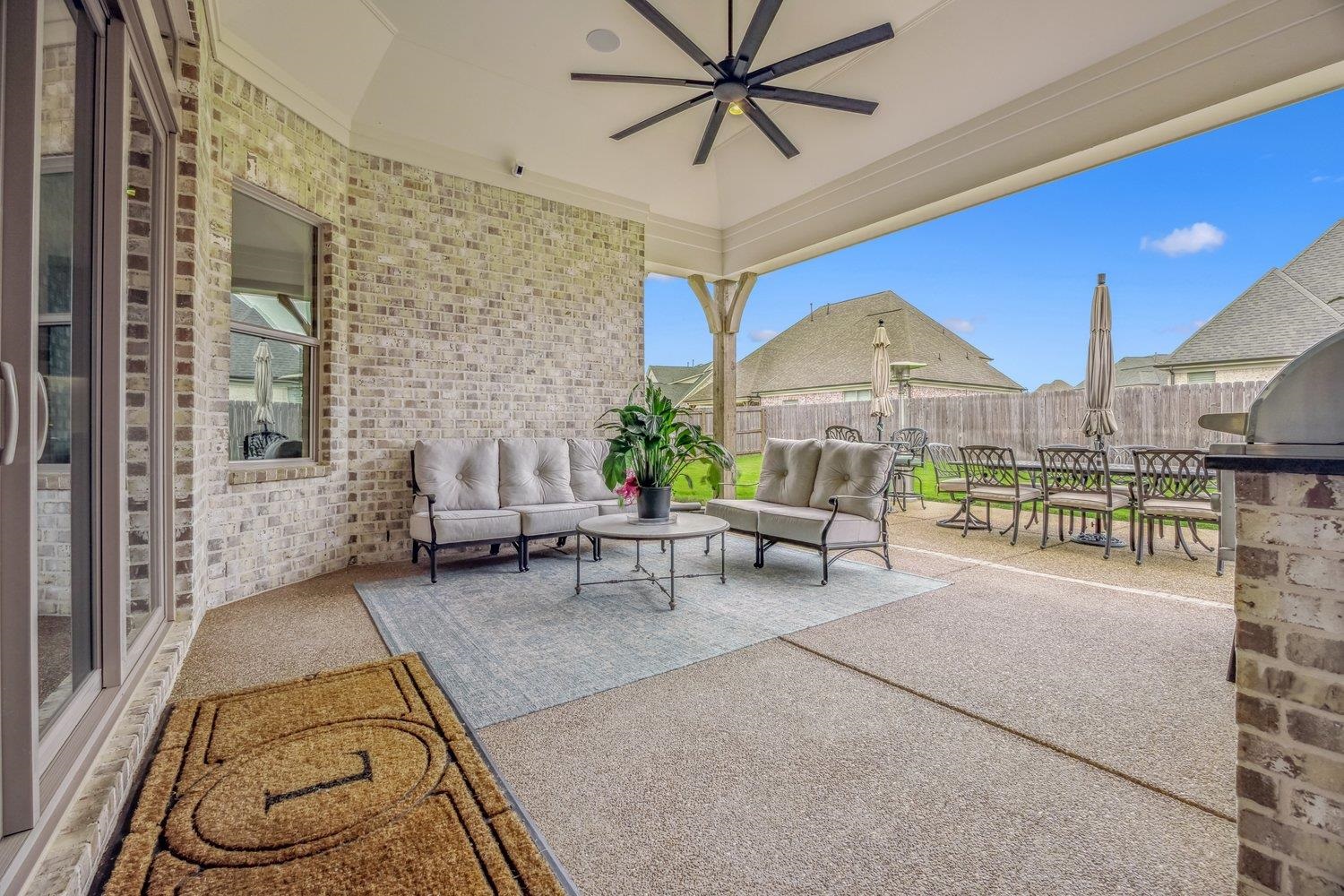 262 Beckham Drive Collierville, TN 38017 - Photo 29 of 32 a living room with furniture and a floor to ceiling window