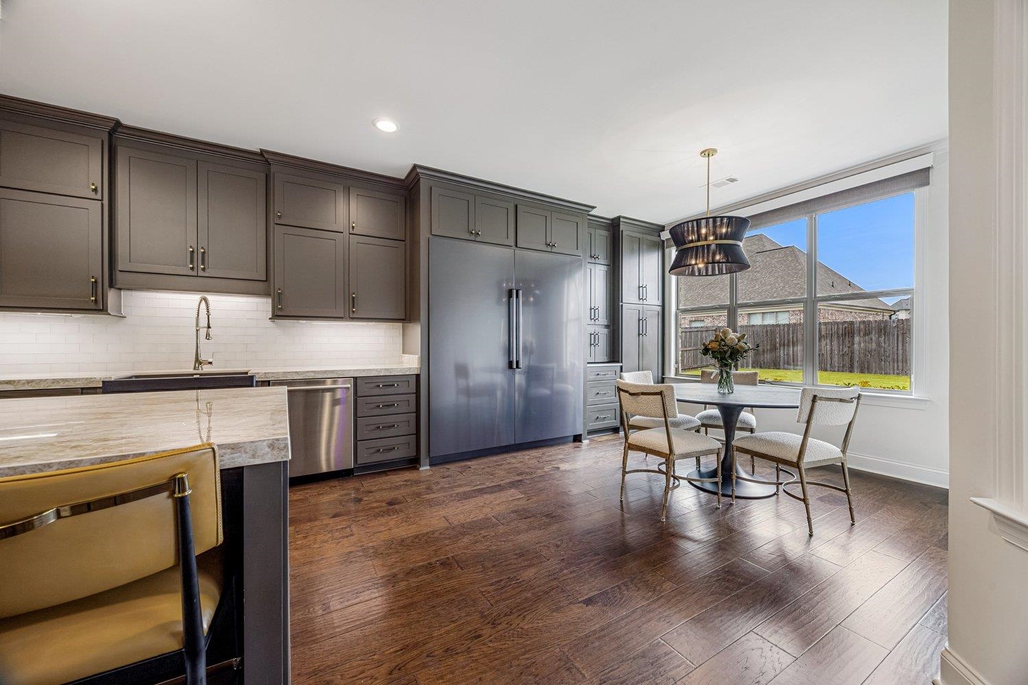 262 Beckham Drive Collierville, TN 38017 - Photo 8 of 32 a kitchen with cabinets and wooden floor