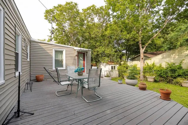 a living room with a couch and a rug