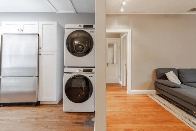 a living room with a washer and dryer