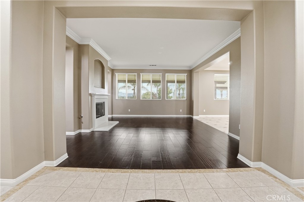 16935 Eagle Peak Road Riverside, CA 92504 - Photo 11 of 75 an empty room with wooden floor and windows