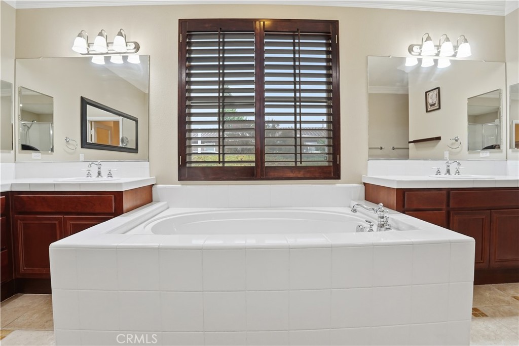 16935 Eagle Peak Road Riverside, CA 92504 - Photo 35 of 75 a spacious bathroom with a sink double vanity and a mirror