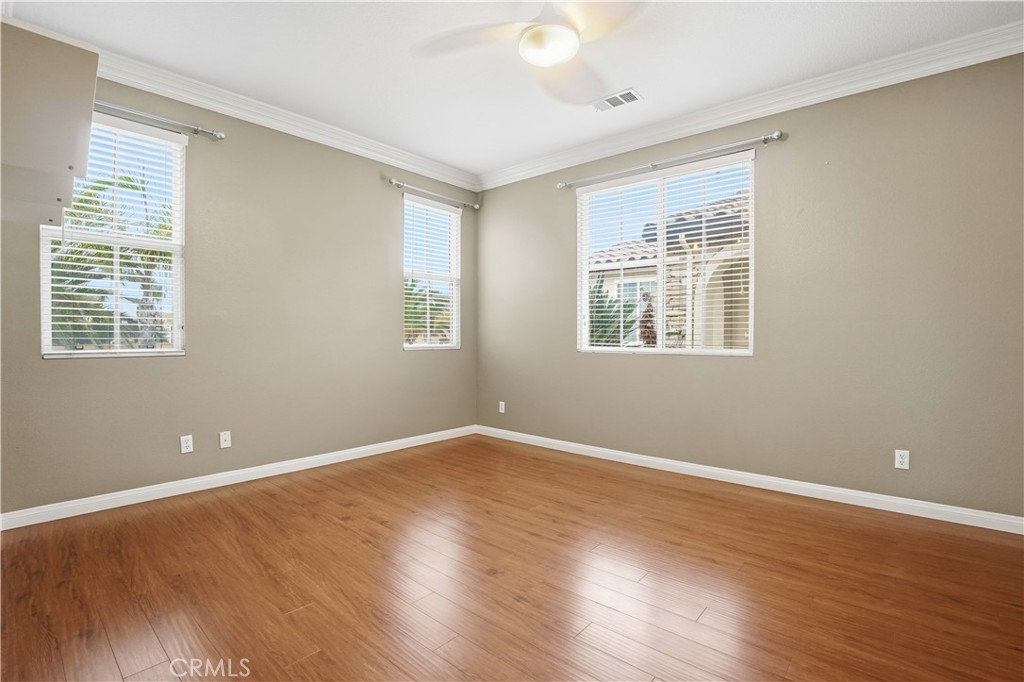 16935 Eagle Peak Road Riverside, CA 92504 - Photo 40 of 75 a view of an empty room with wooden floor and a window