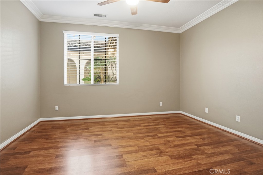 16935 Eagle Peak Road Riverside, CA 92504 - Photo 45 of 75 a view of an empty room with wooden floor and a window