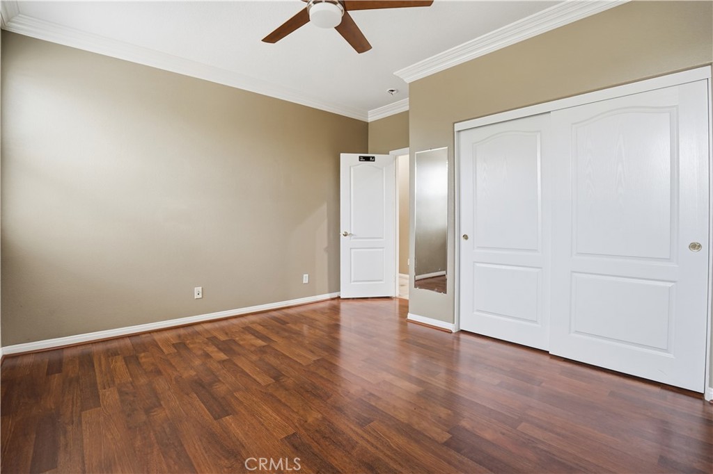 16935 Eagle Peak Road Riverside, CA 92504 - Photo 46 of 75 an empty room with wooden floor and natural light