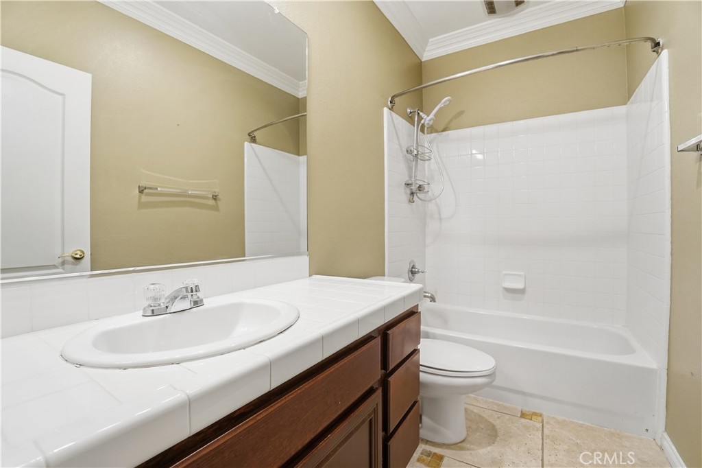 16935 Eagle Peak Road Riverside, CA 92504 - Photo 48 of 75 a bathroom with a granite countertop sink toilet and shower