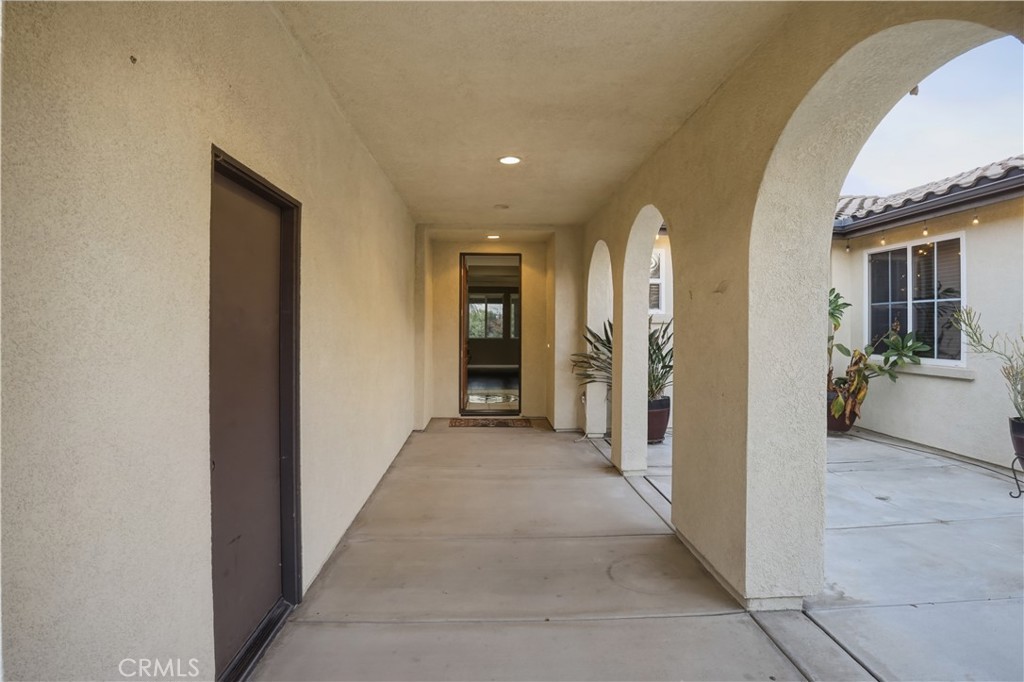 16935 Eagle Peak Road Riverside, CA 92504 - Photo 5 of 75 a view of a hallway with wooden shelves