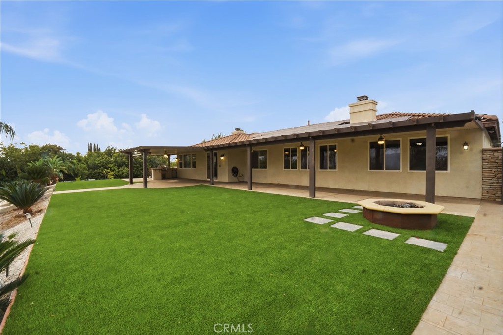 16935 Eagle Peak Road Riverside, CA 92504 - Photo 52 of 75 a view of a house with backyard sitting area and garden
