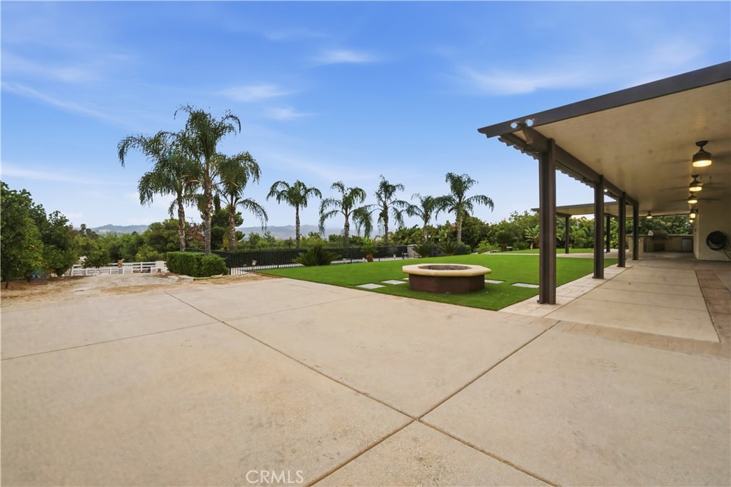16935 Eagle Peak Road Riverside, CA 92504 - Photo 65 of 75 front view of a house with a yard and potted plants