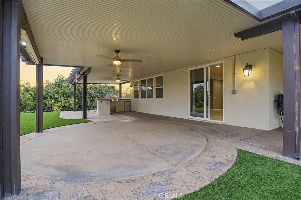 16935 Eagle Peak Road Riverside, CA 92504 - Photo 66 of 75 a view of a house with backyard and a porch