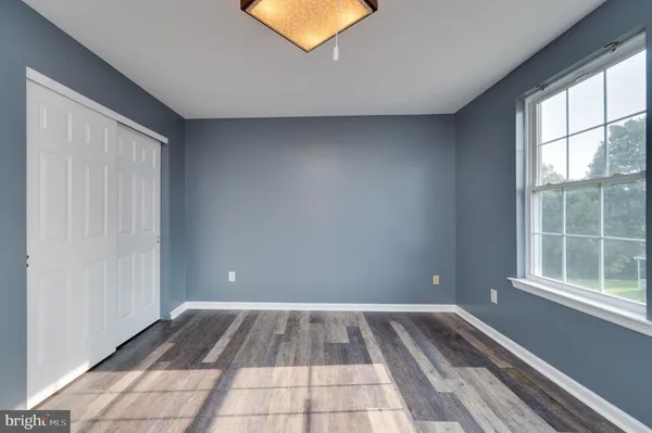 a view of a room with a large window