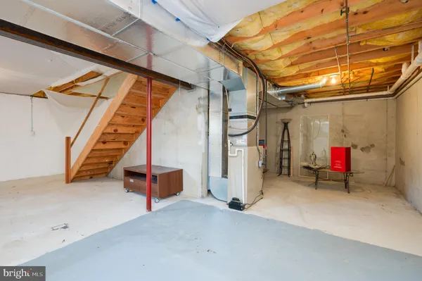 a view of an empty room with a staircase