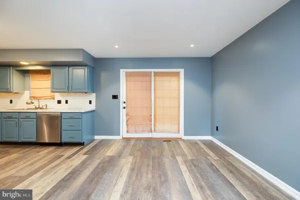 a kitchen with a refrigerator and window