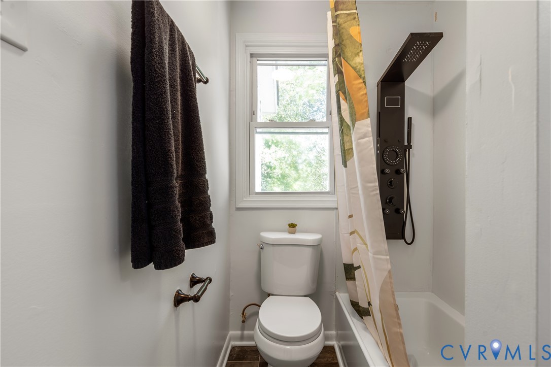 3406 Meadowbridge Road Richmond, VA 23222 - Photo 22 of 41 a bathroom with a toilet and a window