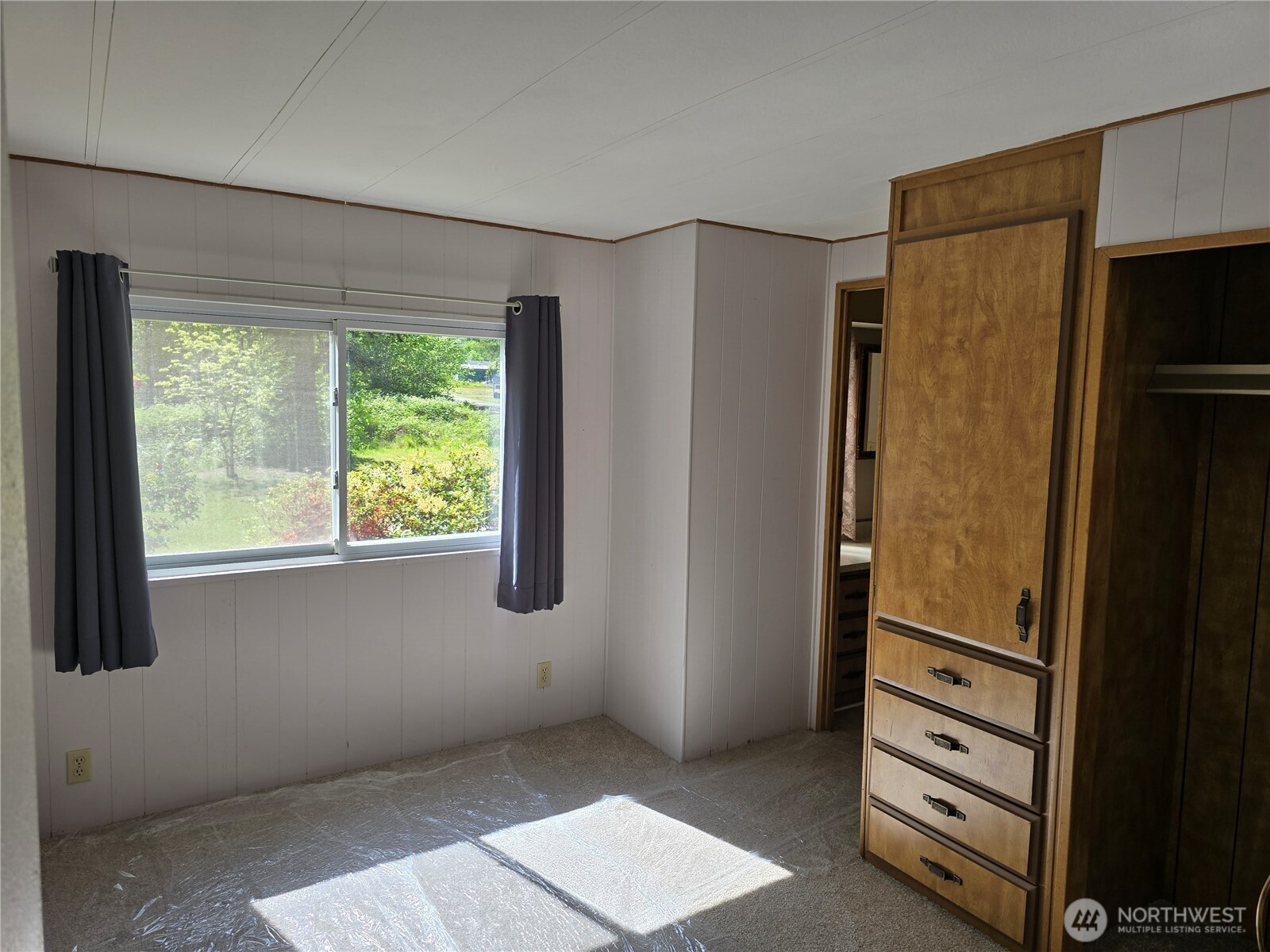 147-21 Morris Road, Unit 21 Randle, WA 98377 - Photo 19 of 31 a view of an empty room with a window